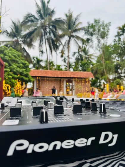 A view of my Pioneer DJ console with the beautiful wedding setup in the background. The best of technology meets the best of tradition.