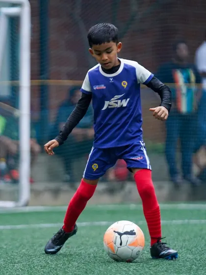 A young player shows focus and control during the Sporthood trials. We look for technical ability and a strong work ethic.