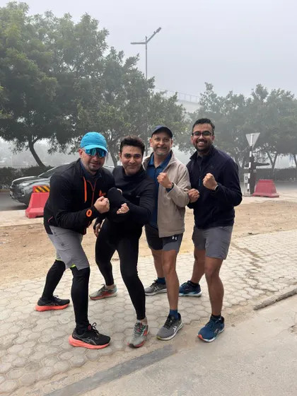 Four of our male runners posing after a foggy morning run. The grind continues, no matter the visibility.