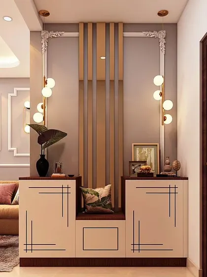 This functional entryway design includes shoe storage cabinets and a central seating bench. The wall paneling and modern globe lights add a touch of contemporary style to the practical setup.