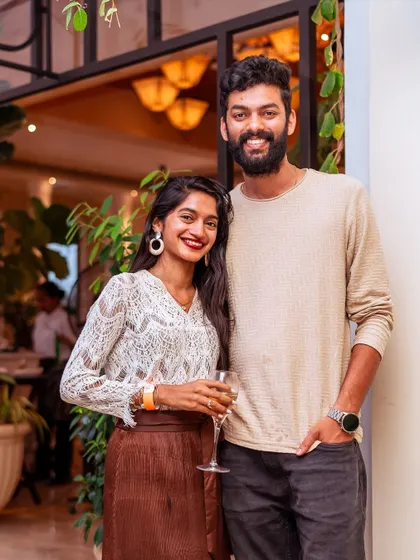 A couple poses for a photo, showcasing the blend of casual elegance that defines the atmosphere at Roxie. It's a place to dress up, relax, and have a wonderful time.
