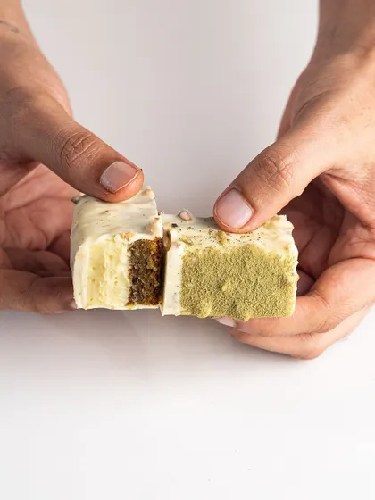 A cross-section of the Pistachio-Passionfruit Cake Bar, showing the delicious layers inside. Learn to make these in my dessert hamper workshop.