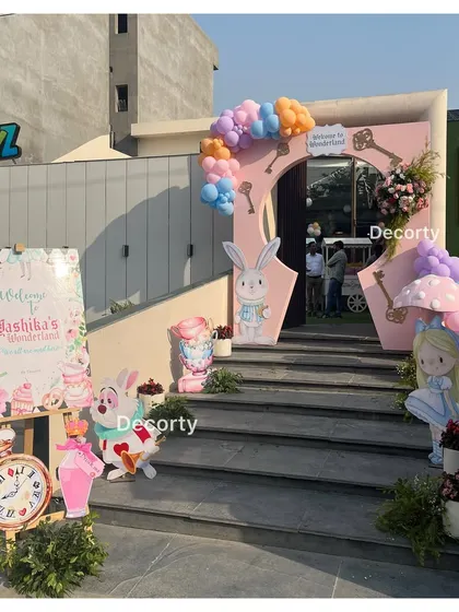 The entrance to "Yashika's Wonderland," with character cutouts and a keyhole arch to welcome guests.
