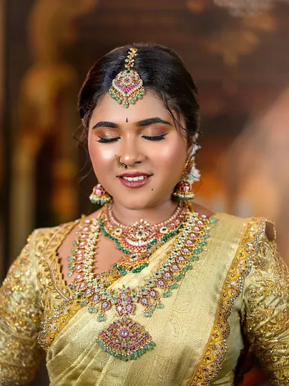 The bride with her eyes closed, showcasing the soft, blended eyeshadow. This highlights the technical skill involved in creating a flawless base and eye look.