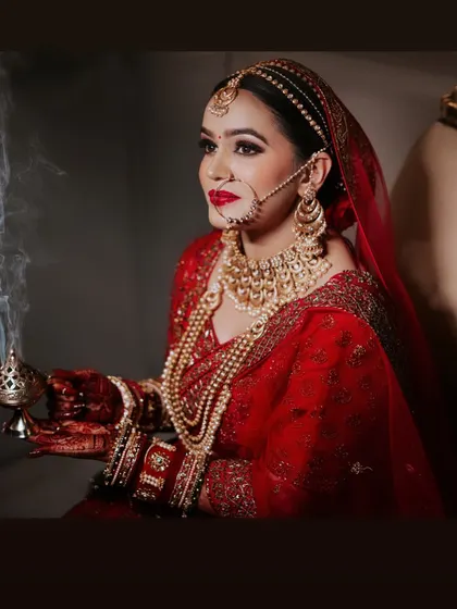 A beautiful shot of my bride holding a traditional incense burner. The makeup is designed to look regal and timeless, fitting for a queen.
