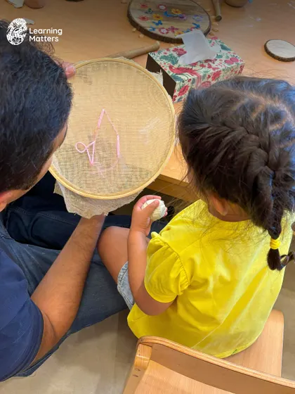 This image, identical to 66, reinforces the importance of parent-child connection. Shared creative moments are powerful opportunities for bonding and mutual understanding.