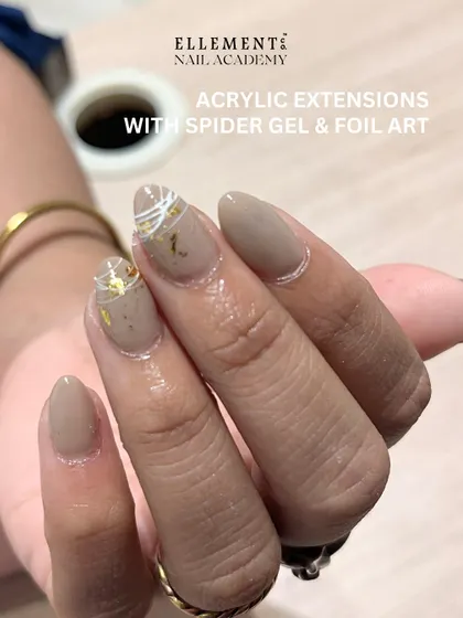Student work showcase: Elegant acrylic extensions featuring sophisticated spider gel and foil art. A testament to the advanced techniques learned here.