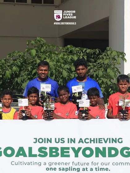 A happy team after their matches, holding saplings to be planted. This initiative adds a meaningful dimension to the tournament experience.