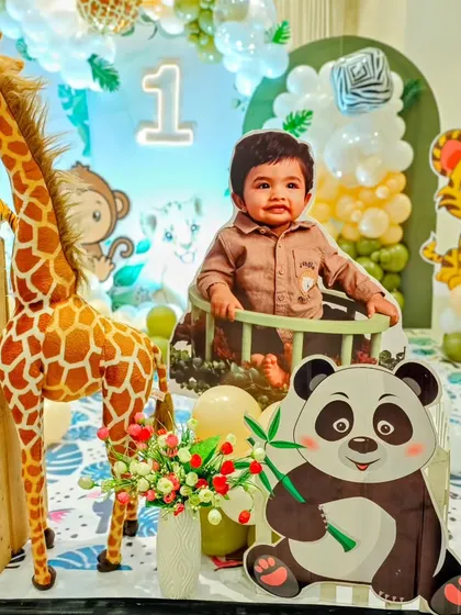 A personalized touch with a cutout of the birthday boy in a safari jeep.