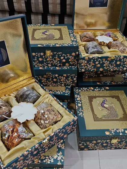 A collection of my exclusive peacock-themed wedding boxes, perfect for luxury wedding invitations or as premium 'bhaji' boxes.