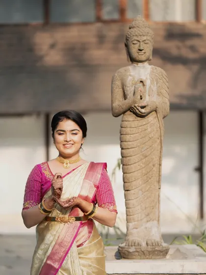 A serene moment captured during the pre-wedding festivities. The makeup is soft and natural.