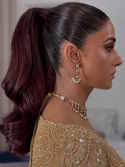 A side profile of the sleek and wavy ponytail, showing its beautiful shape.