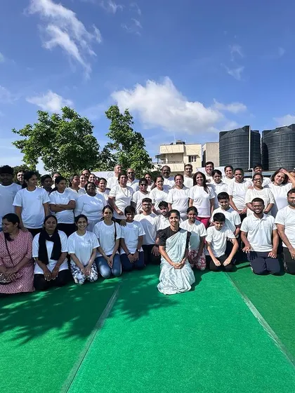A group photo of our happy community after the International Yoga Day celebration in Bangalore, capturing the joy and connection shared.