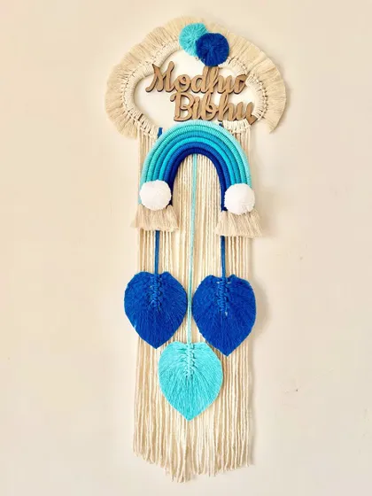 The "Madhav Bibhu" hanging, complete with three shades of blue leaves to match the rainbow.