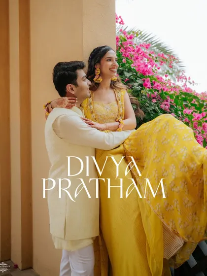 A sun-kissed portrait of the couple, with the bride in a vibrant yellow outfit. The warm light and their happy expressions make this a perfect shot.