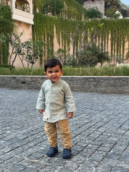 Dressing up the little ones is a joy. This adorable kurta for a young boy is made from our soft and comfortable slub silk, perfect for festive family gatherings.