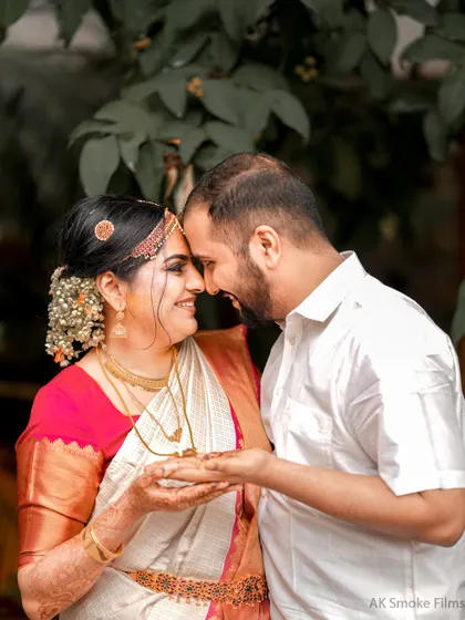 An intimate close-up of a couple during their Kerala Hindu wedding ceremony, capturing a moment of pure joy.