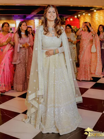 A full-length shot of the bride-to-be looking radiant and happy.