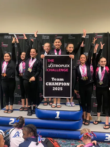 TEAM CHAMPIONS! Our Xcel team celebrates their first-place victory at the Metroplex Challenge in Fort Worth. Nothing beats that feeling of winning together.