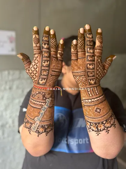 A heavy Indian backhand design that makes a statement. This piece includes personalized elements like a name and a swastika for blessings, woven into a dense, traditional pattern.