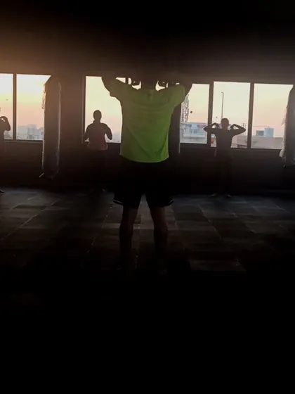 A shot of our rooftop studio at sunset. The silhouettes of our members working out against the evening sky is a whole mood.