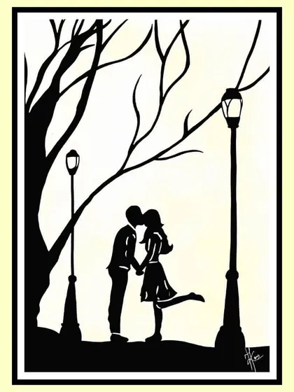 A silhouette of a couple sharing a romantic moment under a streetlamp. It’s about that unexplainable connection, a quiet moment that feels like it's just the two of you in the world.