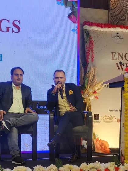 In the middle of a panel discussion, sharing my insights on modern wedding trends and the future of the industry.