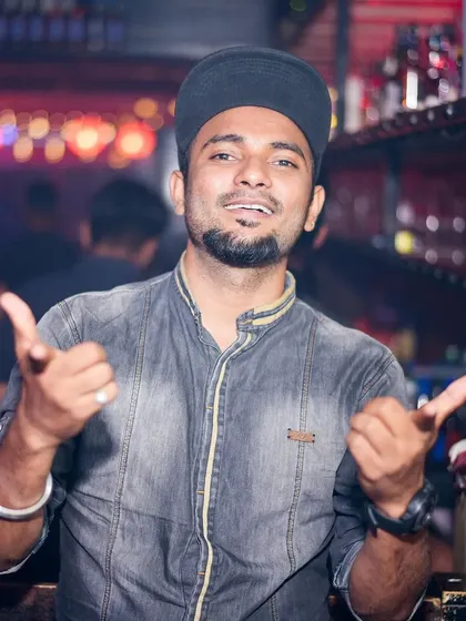 Bringing the energy from behind the console. I play a mix of genres to suit any crowd, from Bollywood and commercial pop to hardstyle and techno.