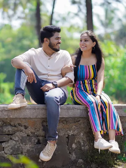 Sharing a laugh while sitting together. Capturing these genuine moments of joy is what makes a photoshoot special.
