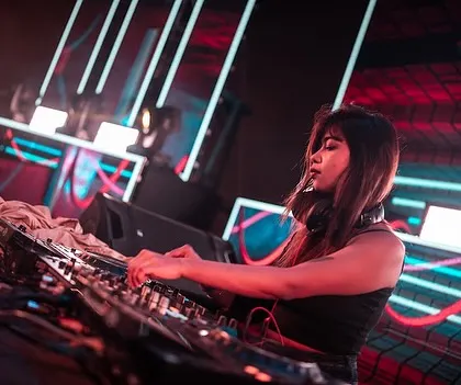 Working the controls under a complex grid of red and blue lights. The production at this event was top-notch, making for a powerful audio-visual show.
