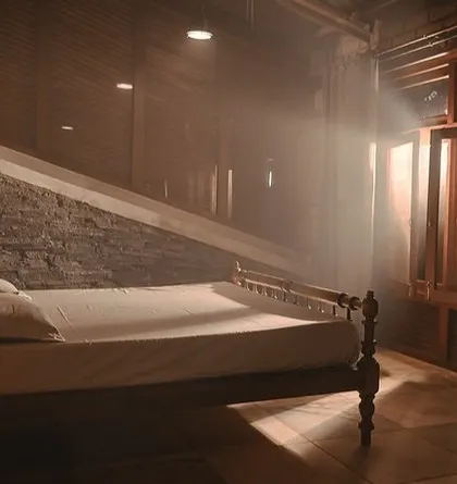 The morning sun streams into a bedroom at a charming cottage in Sakleshpur. The stay is built with mud architecture, keeping it cool and connected to the earth.