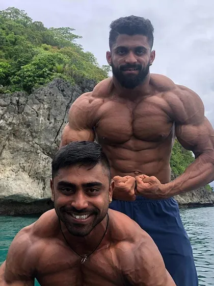 On a boat with a training partner, taking a moment to hit a pose. Fitness is a lifestyle that you take with you everywhere, not just in the gym.