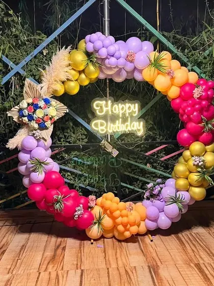 A duplicate image of the colorful balloon wreath, showing its intricate design and mix of textures.