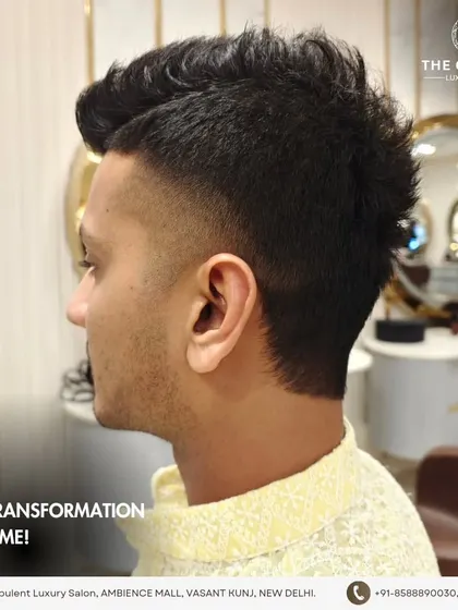 One transformation at a time. This edgy men's haircut features a high fade and a textured, spiky top for a bold statement.