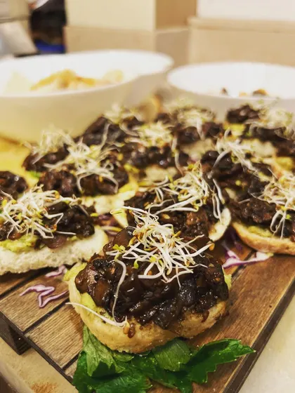 Our mushroom bruschetta is a guest favorite, featuring rich, savory mushrooms on a crispy toast point, topped with fresh sprouts. A perfect vegetarian canapé.
