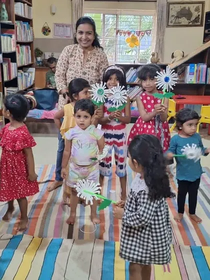 A duplicate of the children holding their beautiful paper flowers.