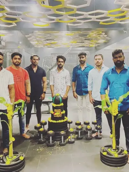 The full team celebrating a gym milestone. We believe in marking our progress and enjoying the journey together. This is the spirit of our fitness family.