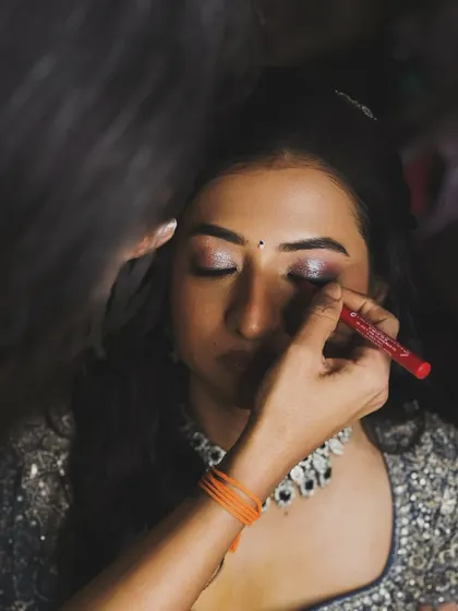 A behind-the-scenes shot of me adding the final touches. Creating that perfect, shimmering eye is a detailed process that makes all the difference.
