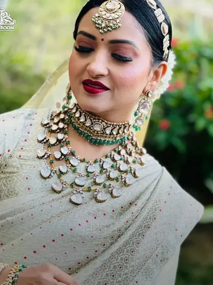 A close-up of the makeup, showing the flawless base, classic winged liner, and bold lip. This is a timeless look that exudes confidence.