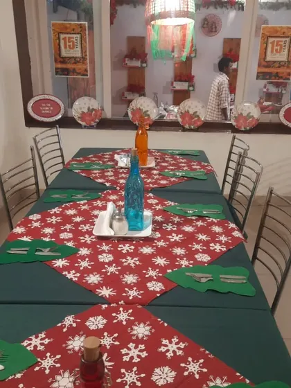 Our tables are set for a magical Christmas experience. The festive runners and decor create a warm, inviting atmosphere for your holiday gatherings.