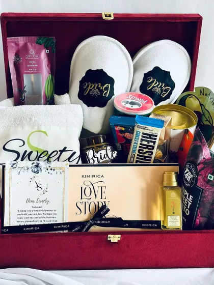 A detailed shot of the bridal hamper, showing the personalized name on the towel and the "Bride" candle, making it an extra special gift.