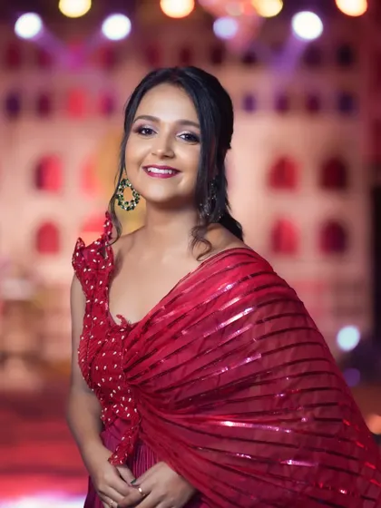 A lovely portrait of actress Nisha Milana from the Zee Kutumba Awards. Her smile and the vibrant background capture the excitement of the event.