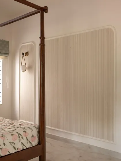 Wall paneling detail from 'Project Varnika', using simple stripes and arched frames to add architectural interest.