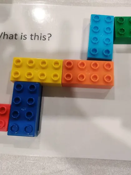 From our teacher training with the "Six Bricks Program." This image shows how a few simple Lego blocks can be used to create patterns and teach spatial reasoning.