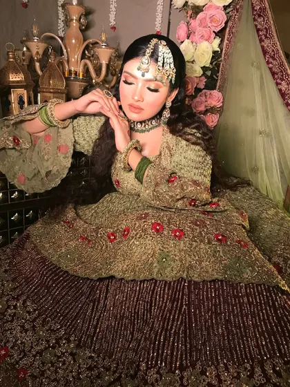 A serene and graceful portrait. The makeup is soft and luminous, with closed eyes to show the subtle yet beautiful eyeshadow work.