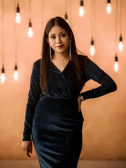 A classic smokey eye and a subtle red lip create a timeless cocktail look. This is perfect for evening party makeup or a glamorous portfolio shoot, designed to look stunning under any lighting.
