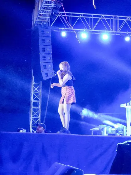 A side view of the stage, showing the scale of the sound system and lighting rig provided for Monali Thakur's concert.