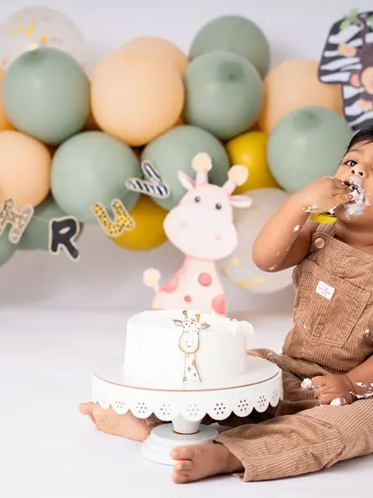 The first taste! This is a milestone moment within the cake smash session itself. The look of curiosity and delight as they get their first big taste of birthday cake is absolutely priceless.