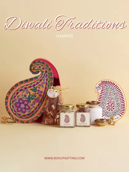 The "Diwali Traditions" hamper, presented in a unique paisley-shaped box. It’s a modern take on classic gifting, containing saffron, almonds, and traditional diyas.