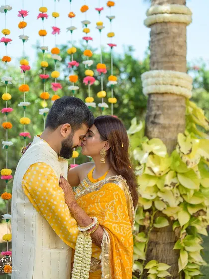 A tender kiss on the forehead. These quiet, intimate moments amidst the chaos of a wedding celebration are often the most precious to look back on.